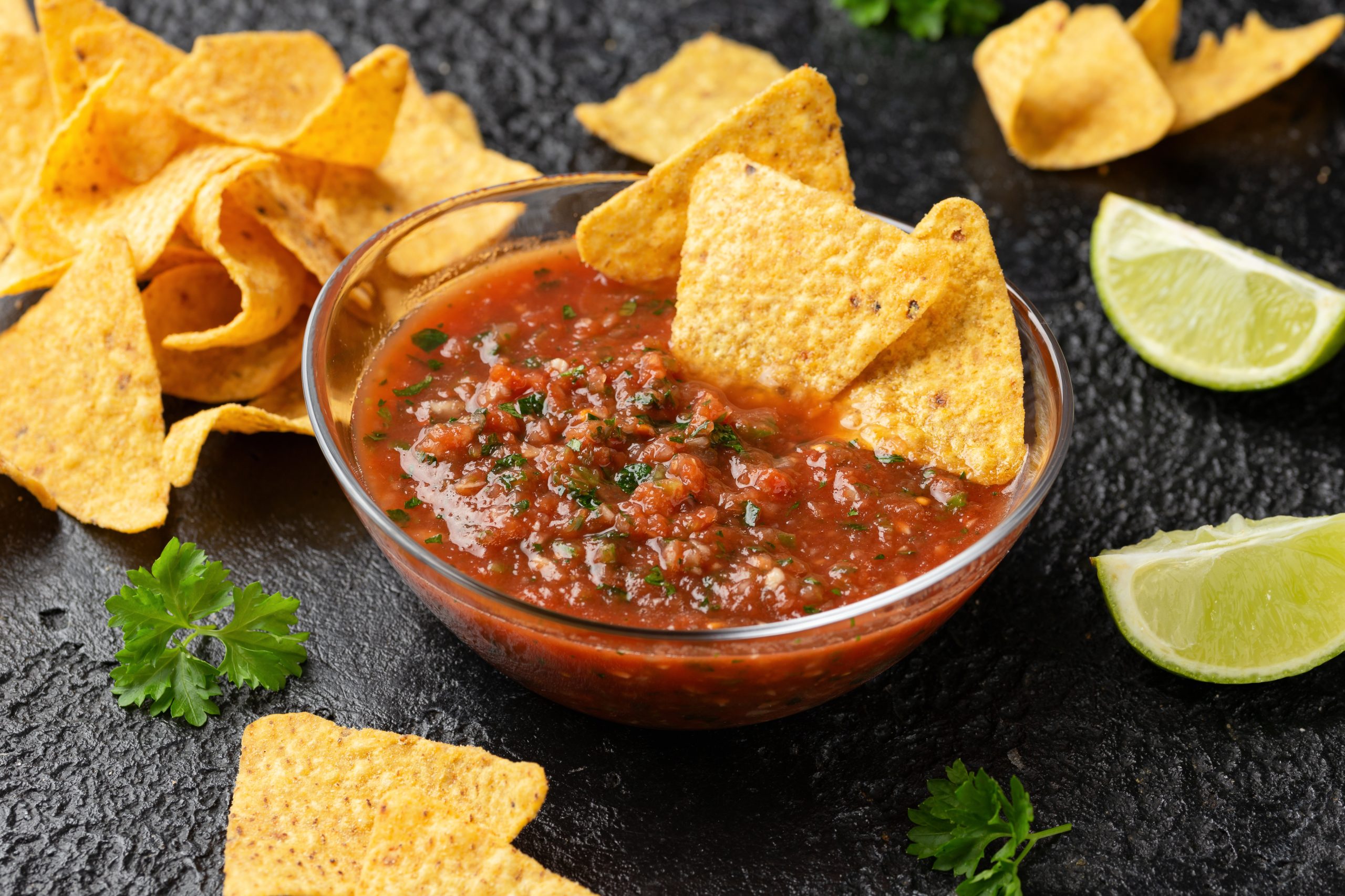 Mexican Tomato Salsa with lime, onion, jalapeno pepper, parsley and tortilla chips.